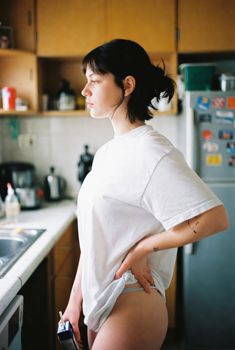 Woman in Kitchen with Drink